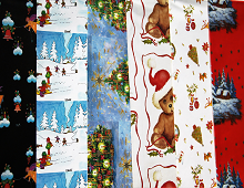 Viser 6 forskjellige motiv av julegavepapir. Bamser, engler, juletrepynt, juletre, hytte i skogen.