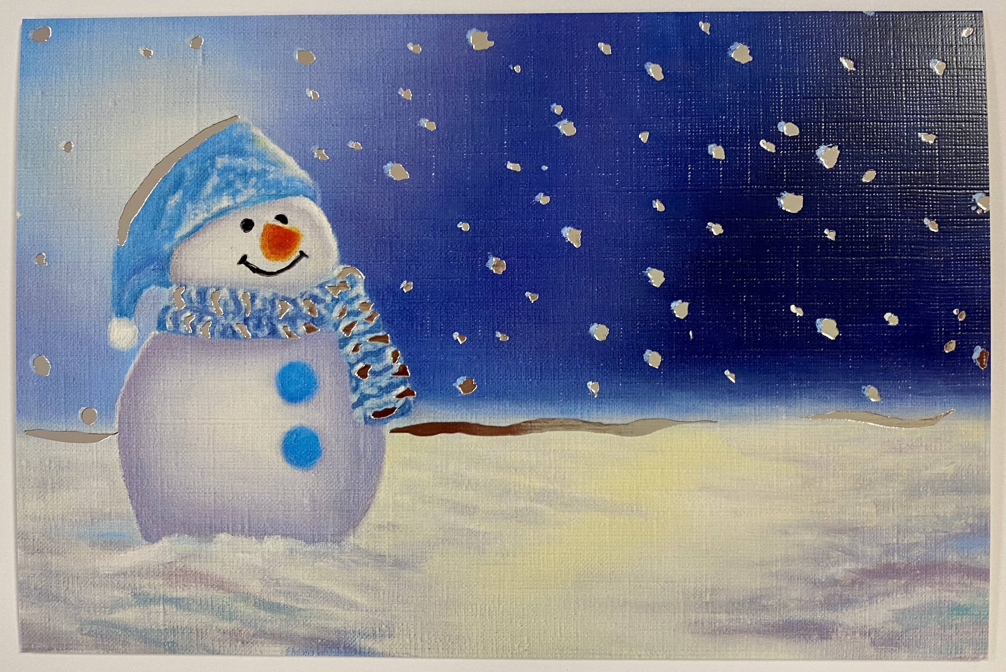 Julekort med bilde av glad snømann. Bilde